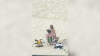 A couple having sex on the beach