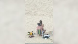 A couple having sex on the beach #2