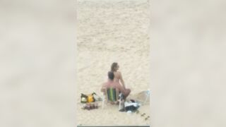 A couple having sex on the beach #4